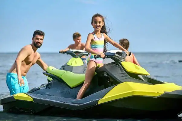 Family enjoying ride water scooter