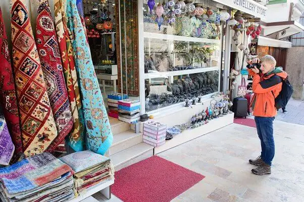 Tourist taking photo turkish souvenir shop 